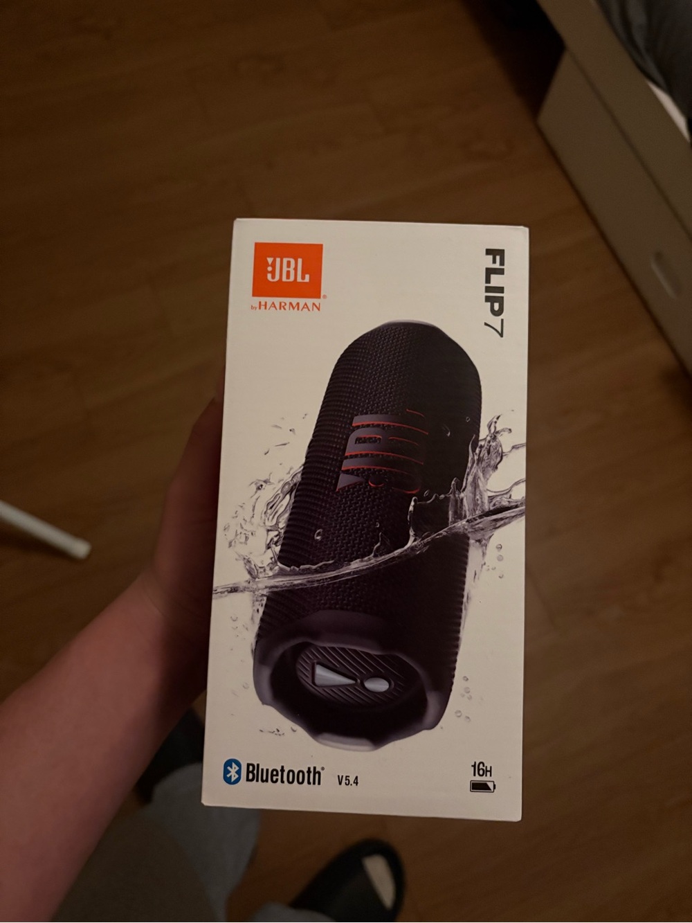 JBL Flip 7 Portable Bluetooth Speaker - Black with Orange Accents